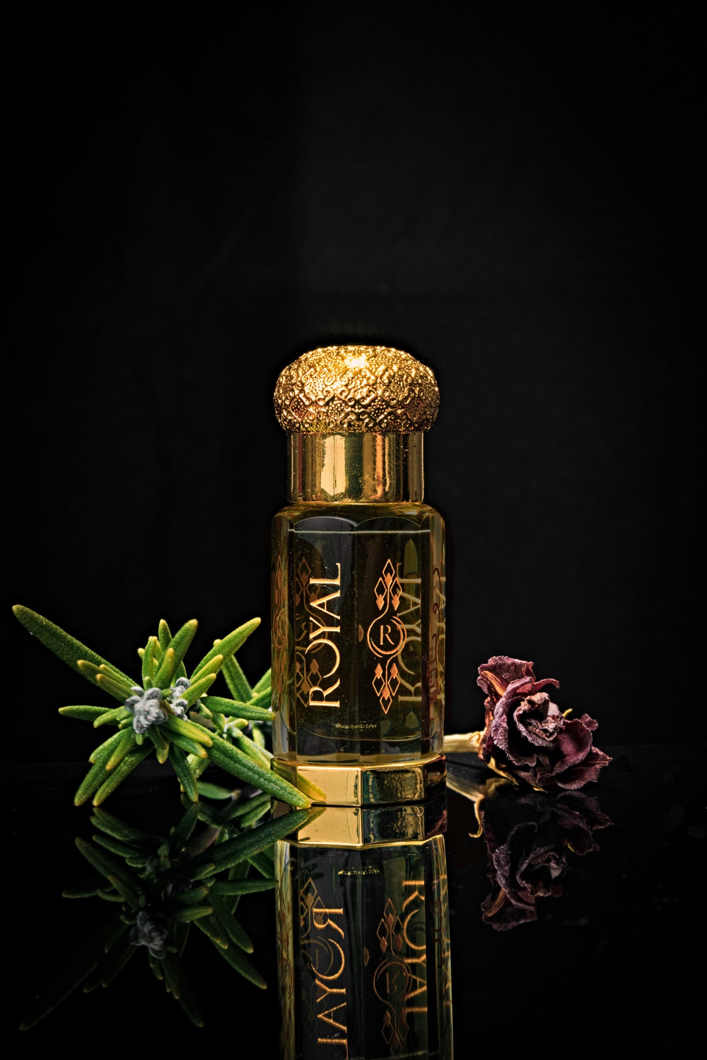Royal 1437 Perfume Oil in an elegant bottle, with a rose and rosemary sprig in the background, showcasing the luxurious fragrance and botanical inspiration.”